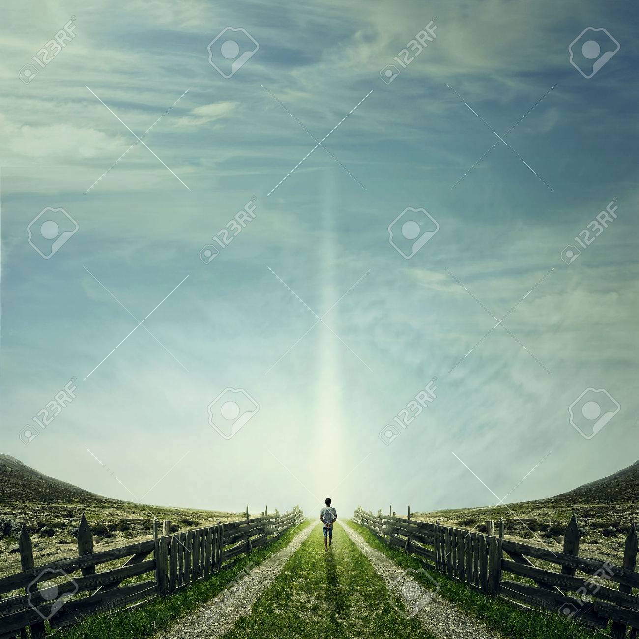 65313788-man-walking-on-a-country-road-with-a-relax-mood-following-a-light-way-of-life-concept.jpg