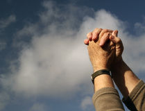 clasped-hands-praying-clouds-sky-background-together-blue-white-cloud-39038347.jpg